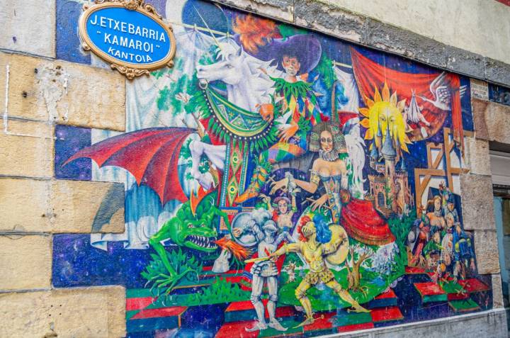 BILBAO, SPAIN - MAY 9, 2014: Urban art in a narrow street in the old town of Bilbao, Basque Country Spain, called "Mural del Canton J. Etxebarria «Kamaroi»", made by Juan Zarate Ibargoitia in 1994